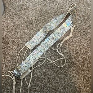 White and silvery shell beaded rope belt. One or two pieces missing.
